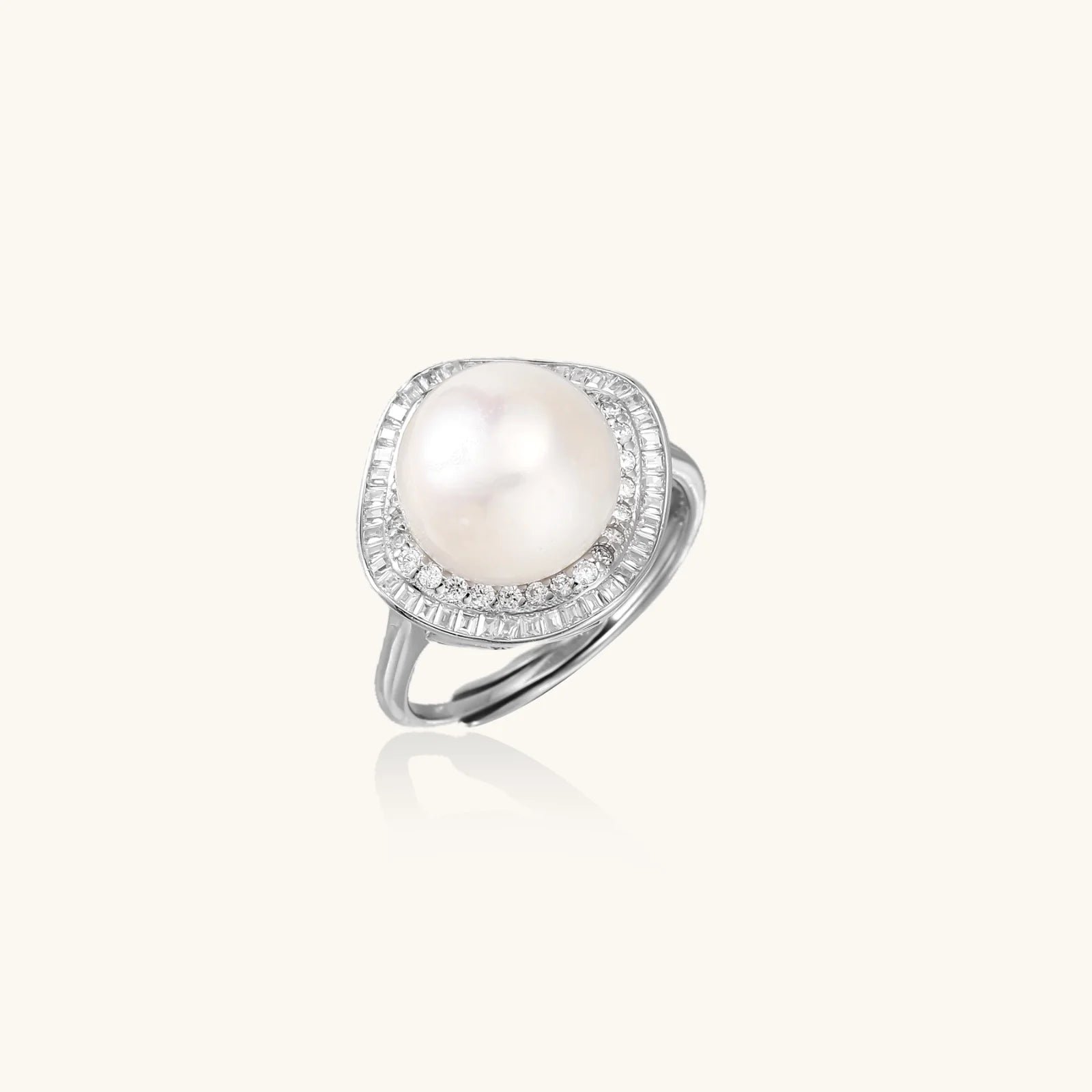 Rhodium-plated silver ring with round pearl center, double halo of baguette and round crystals forming cushion shape