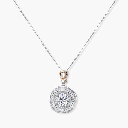 Sterling silver necklace with circular geometric pendant featuring central moissanite and radial baguette pattern.