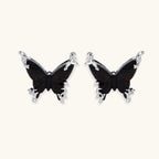 Wooden butterfly earrings with silver chain details in light and dark wood variants on white background