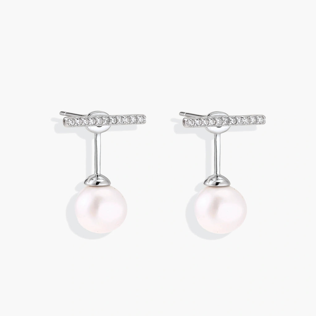 Rhodium-plated sterling silver ear jacket earrings with diamond-set horizontal bar and freshwater pearl drop