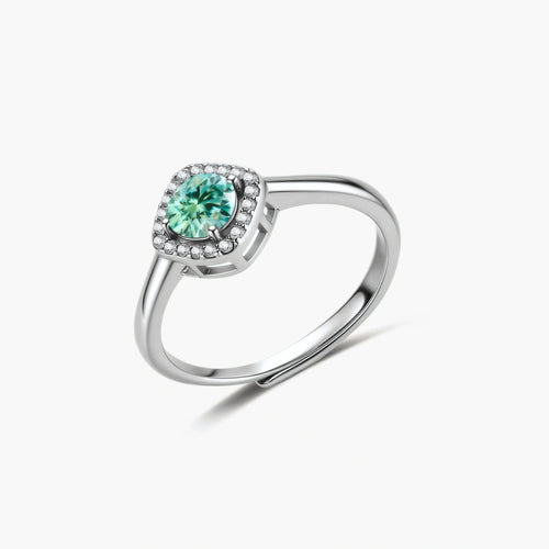 Sterling silver adjustable ring featuring round green moissanite center stone surrounded by clear halo stones
