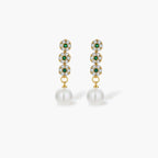 Gold-plated jewelry set with green cubic zirconia floral motifs, featuring matching necklace and pearl drop earrings
