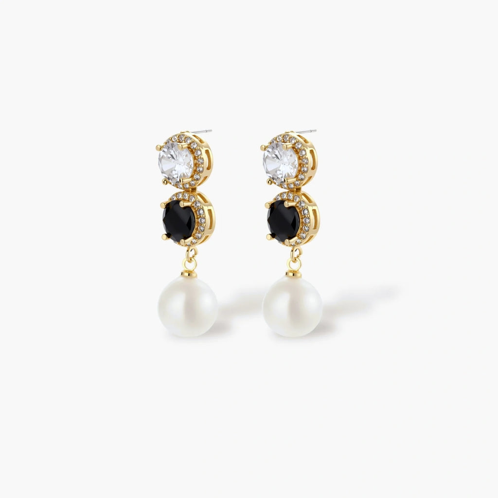 Gold-plated jewelry set with alternating black and clear cubic zirconia stones, featuring necklace, earrings and bracelet