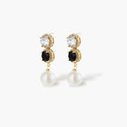 Gold-plated jewelry set with alternating black and clear cubic zirconia stones, featuring necklace, earrings and bracelet